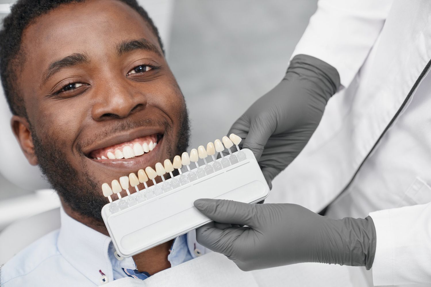 Patient smiling after cosmetic veneer treatment